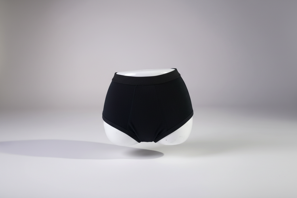 Black high-waisted underwear on a gray background